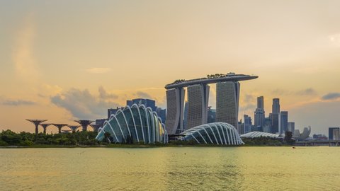 Singapore City, Singapore - 28 July, 2019: Footage 4k Timelapse, Skyscrapers with night lights and main showplaces, Day till night coast view Singapore flyer, Marina Bay, Singapore.