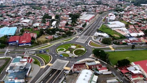 Beautiful Cinematic aerial time-lapse of the traffic in the roundabout in Costa Rica