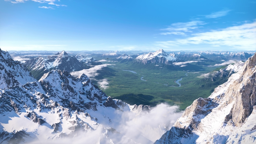 A steppe eagle flying over the snow mountain surrounded by clouds. Sunlight shining on grand and vast mountain range and grassland. Some elements are from Topographic data from OpenTopography. Royalty-Free Stock Footage #1064991202