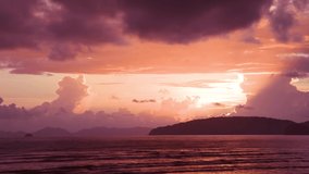 Amazing beam light sunset on the beach, sunset and sky under dense  clouds, Nature background, Pink and purple color tone