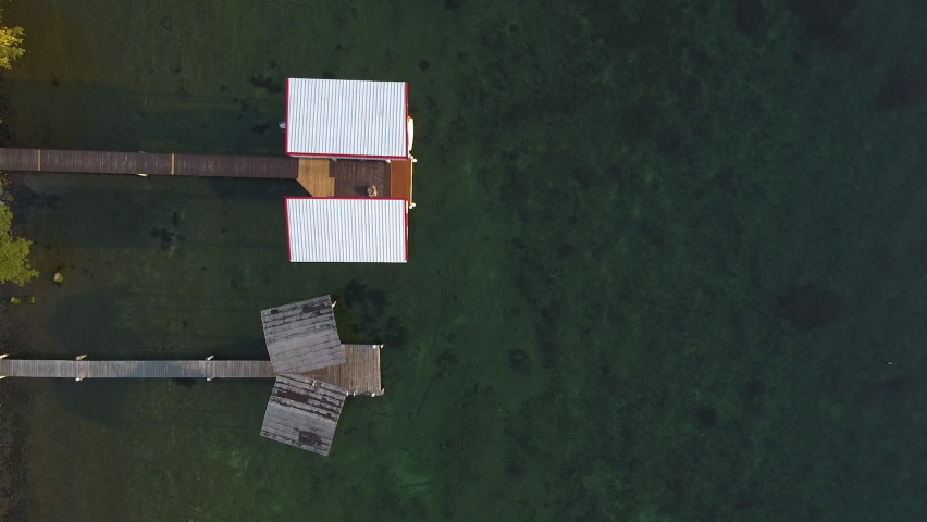 Static aerial drone of a residential dock on Seneca Lake from above