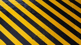 Danger zone sign on floor. Man walking across yellow-black Industrial safety area inside factory. Stripes of warning. Caution and attention area. warning striped rectangular background. 4 k video