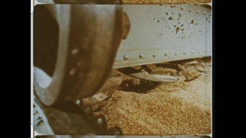 1970s St Louis, MO. Barley Malt in Process. Grain soaking in water, germinates, then died with hot air.  4K Overscan of Archival 16mm Film Print