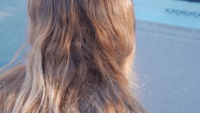 Teen girl looking at the United States Constitution on display . High quality 4k footage - Powered by Shutterstock - Get 15% off with code: PIKWIZARD15
