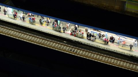 Yeouido, Seoul, South Korea - April 15 2012 : subway station and subway pass, people night timelapse