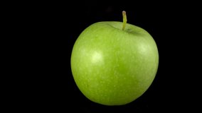 Macro shot of red apple. Close up rotate fresh Green apple on black background. - Powered by Shutterstock - Get 15% off with code: PIKWIZARD15