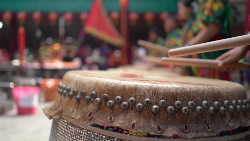 People drumming the Chinese drums to celebrate Lunar New Year | Shutterstock HD Video #1065090901