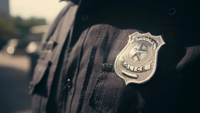 Cropped view of special police lettering on badge of policeman Royalty-Free Stock Footage #1065097792