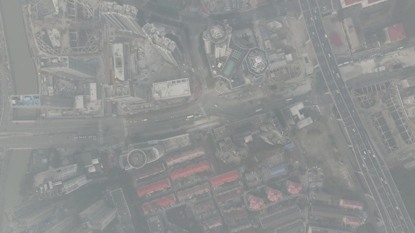 City in heavy haze and air pollution. Building and roads in fog in day time. Environmental conservation and air pollution issues concept b-roll footage. Highly polluted residential area Shanghai China