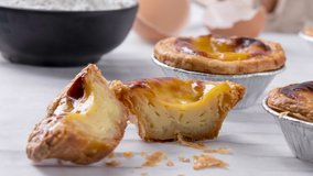 Motion position panning video Egg tart, traditional Portuguese dessert, pasteis de Nata Portuguese Custard Tarts food on a Cooling Rack. Typical custard pies. - Powered by Shutterstock - Get 15% off with code: PIKWIZARD15