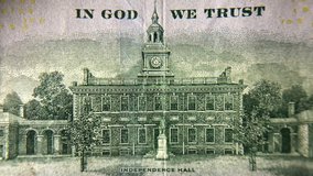 4K HD video zooming in on an image of Independence Hall on the back of a U.S. 100 dollar bill. Extreme close up.
