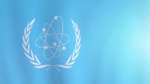 Waving flag of the International Atomic Energy Agency. International flag of IAEA