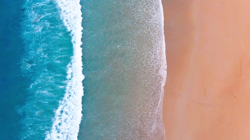 Aerial view of drone. Scene of top view beach and seawater on sandy beach in summer. Nature and travel concept. Royalty-Free Stock Footage #1065107863