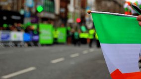 Irish flag on Saint Patrick's Day parade in Dublin - Powered by Shutterstock - Get 15% off with code: PIKWIZARD15