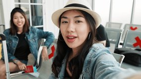 Authentic shot vlog of asian tourist group using camera on smartphone recording selfie herself with friend group taking and having fun together. First outing after the pandemic of Covit19.