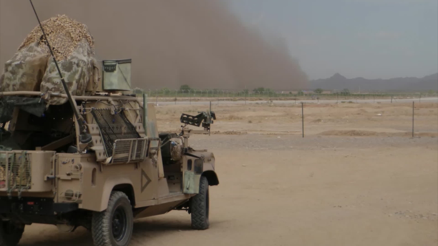 Military vehicle against desert storm in Afghanistan