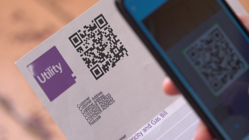 Payment of utilities using QR code and mobile device. Utility Billing Online. QR Code Payment. A man scanning the QR code with app and paying utility bills using his smartphone | Shutterstock HD Video #1065126478