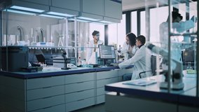 Modern Medicine Research Laboratory: Diverse Team of Multi-Ethnic Young Scientists Doing Experiment. Advanced Lab with High Tech Equipment, Microbiology Researchers Design, Engineer, Develop Drugs - Powered by Shutterstock - Get 15% off with code: PIKWIZARD15