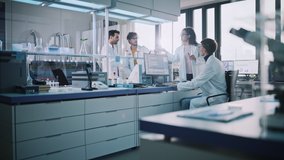 Modern Medicine Research Laboratory: Diverse Team of Multi-Ethnic Young Scientists Doing Experiment. Advanced Lab with High Tech Equipment, Microbiology Researchers Design, Engineer, Develop Drugs - Powered by Shutterstock - Get 15% off with code: PIKWIZARD15