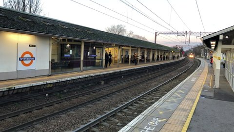 London UK, January 6th 2021: Seven Sisters station, a train from Enfield arriving at the platform. Train service to Liverpool Street, platform is quieter than normal due to Tier 4 London lockdown.