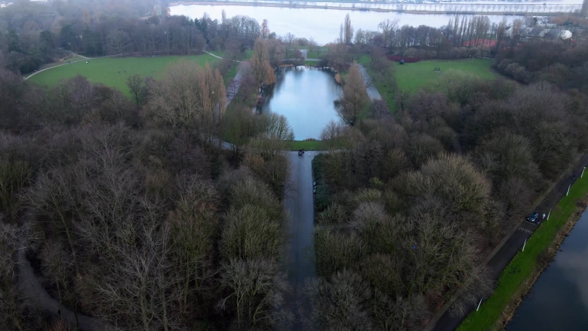 The Flevopark in Amsterdam East North-Holland The Netherlands aerial hyperlapse of people enjoying a walk in the park on a sunday.