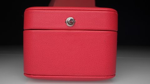 extremely close-up, detailed. red jewelry gift boxes with white ribbon.