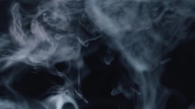 Slow motion of gray paint on a black background. Colored acrylic cloud abstract smoke explosion animation.