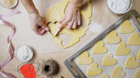 The process of making homemade Valentine's Day cookies on the table. View from above. Baking cookies for Valentine's Day - Powered by Shutterstock - Get 15% off with code: PIKWIZARD15