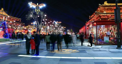 Xian, Shaanxi, China-February 6, 2019:Residents watch a lantern and light show in the Tang Dynasty City  to celebrate the Chinese New Year. Xian the ancient capital of China, now  a internet celebrity