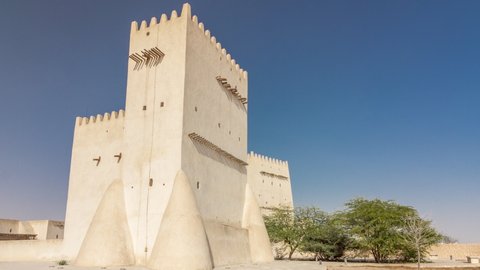Barzan Towers timelapse hyperlapse, watchtowers in Umm Salal Mohammed near Doha - Qatar, the Middle East. Blue sky at sunny day