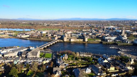 Aerial view over Limerick City in Republic of Ireland. There are number of eye-catching landmarks in Limerick such as Thomond Bridge,  King John's Castle, St. Mary's Cathedral and River Shannon.
