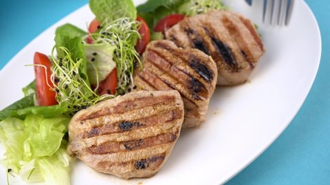 Meat with vegetables. Pork medallions. Grilled meat. Cutlets close-up. Beef Food. Grill food.