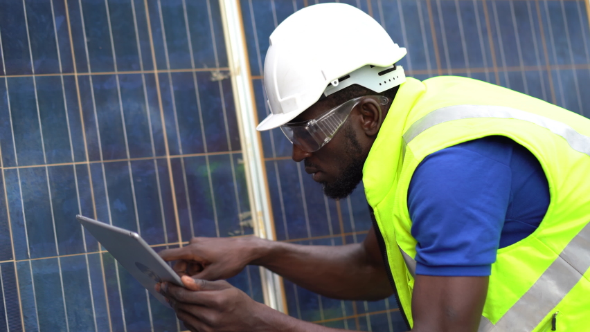African american technician using laptop computer checking Solar Cell panels . engineer repair and maintenance photovoltaic Royalty-Free Stock Footage #1065198184