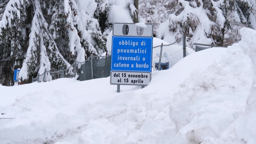 Snow plow that removes snow from the mountain road after heavy snowfall.
Roadside assistance vehicles in action during the winter on mountain roads
