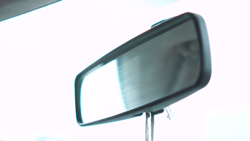 Man adjusting rearview mirror in car. 4k | Shutterstock HD Video #1065218899