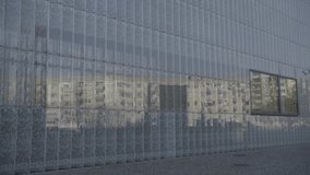 A large number of reflecting glass segments creates a unique urban reflection image, a 4K (Sony S-Log) video clip, Warsaw, Poland.