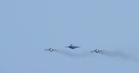 F-35 stealth multirole combat aircraft of Italian Air Force close-up. Lockheed Martin F-35 in flight in formation with two AMX International AMX ground attack aircrafts. Ravenna Airshow June 23th 2019
