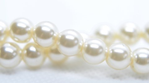 Pearls. Pearl necklace approximated on a light background