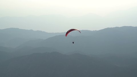 Parachutists are paragliding in Tahtali-Olympos mountains. Antalya Turkey