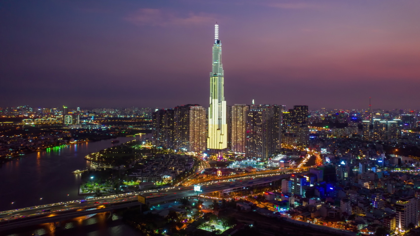 Aerial Hyper Lapse in Vinhomes Landmark 81 at night with New Year's Eve Fireworks, Binh Thanh District, Ho Chi Minh City, Vietnam Royalty-Free Stock Footage #1065245845
