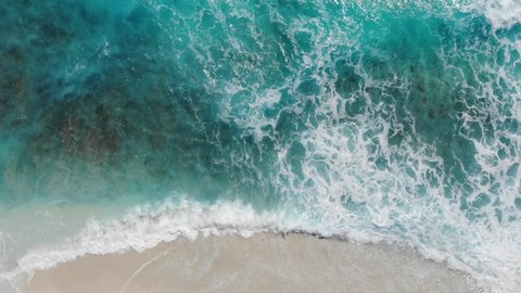 Aerial Drone Video of Waves Crashing on the White Sandy beach of Maldives