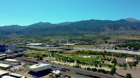 Drone aerial of Pikes Peak mountain range and highway in Colorado Springs, CO