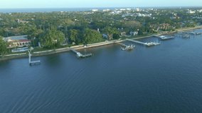Aerial intercostal reverse reveal of ocean and yachts