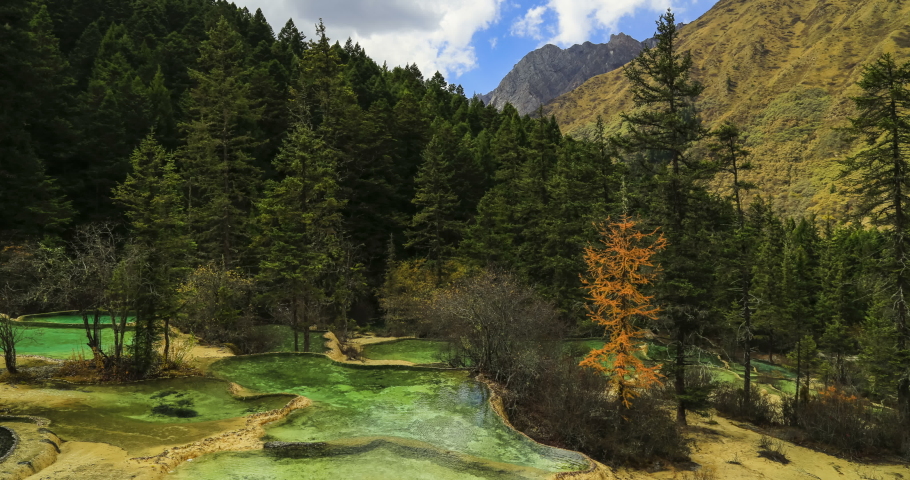 Huanglong Mountain with beautiful nature calcification pool ,waterfalls,lake in Sichuan , China. In December 1992, the UNESCO inscribed Huanglong on the World Heritage List as a natural heritage.