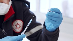 Paramedic giving people the COVID-19 vaccine injection during the vaccination operation - Powered by Shutterstock - Get 15% off with code: PIKWIZARD15