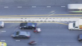 4k Timelapse overhead view of the road traffic at a highway junction, top-down view of a freeway car moving fast on the road, Business economy or transportation concept b-roll footage of city life.