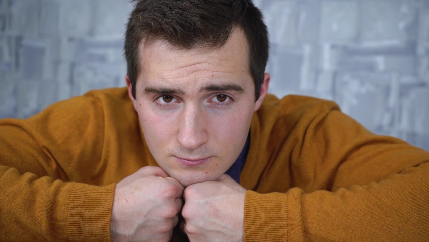 tired man looking at the camera