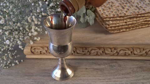 Passover celebration with matzo unleavened bread kiddush cup of wine