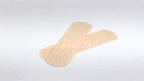 Sterile medical patch for wounds and calluses close-up. Turntable. Selective focus.