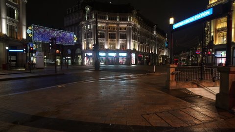 London, UK, 28-12-2020: Oxford Circus Underground Tube Station, closed in the Covid-19 Coronavirus lockdown in London, with quiet empty roads at Oxford Street, the popular tourist destination.